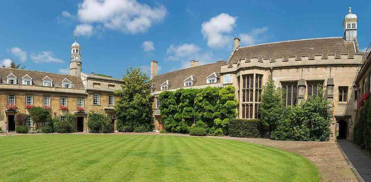 The First Court of Christ's College at Cambridge University, with well-kept lawns and historic buildings.