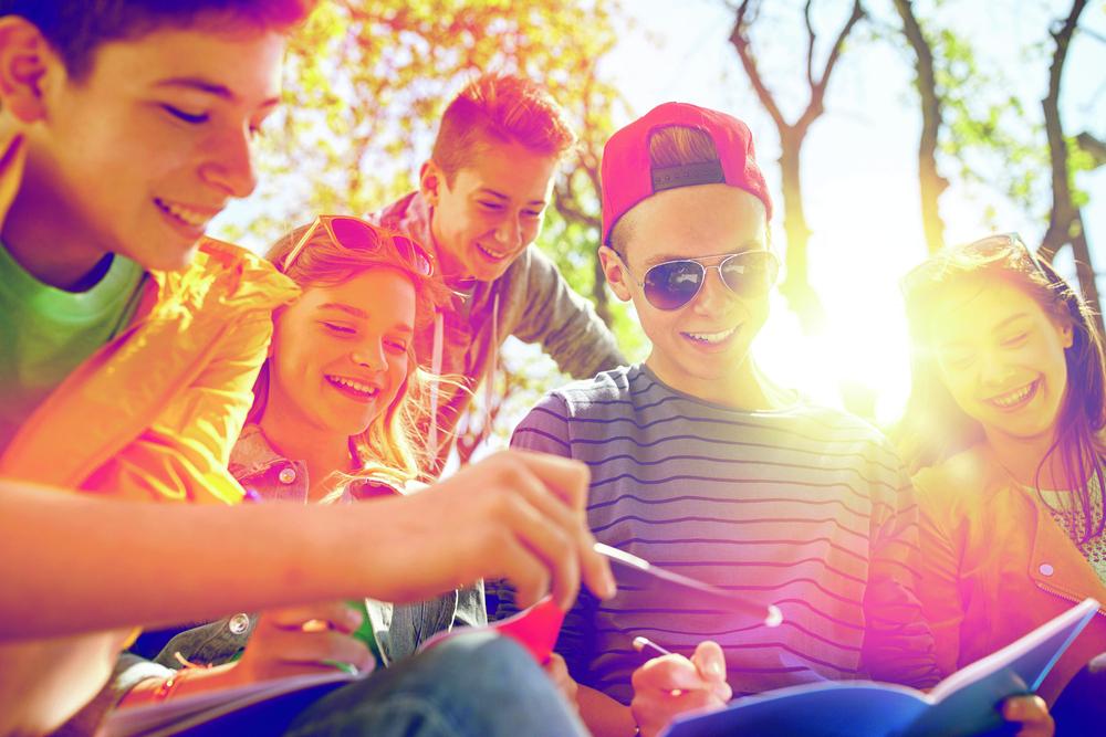 a group of children laughing outside