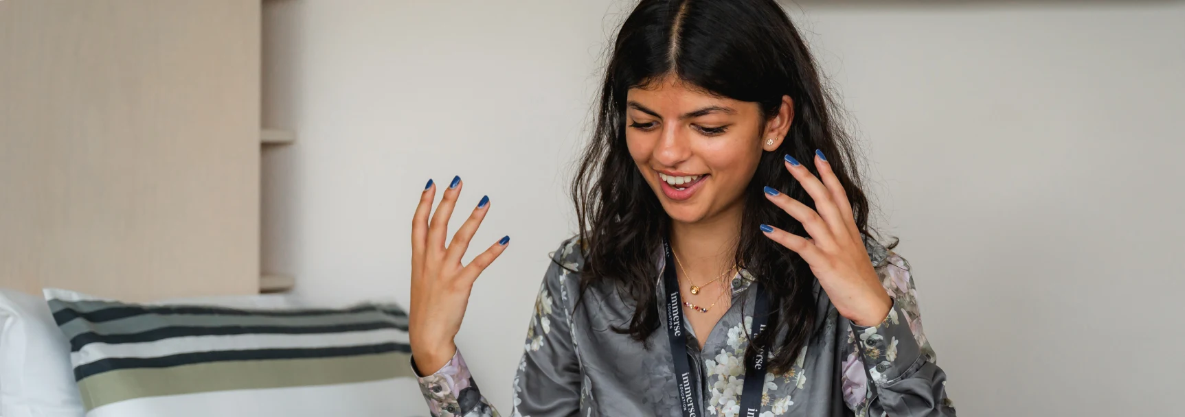 A woman explaining with hand actions.