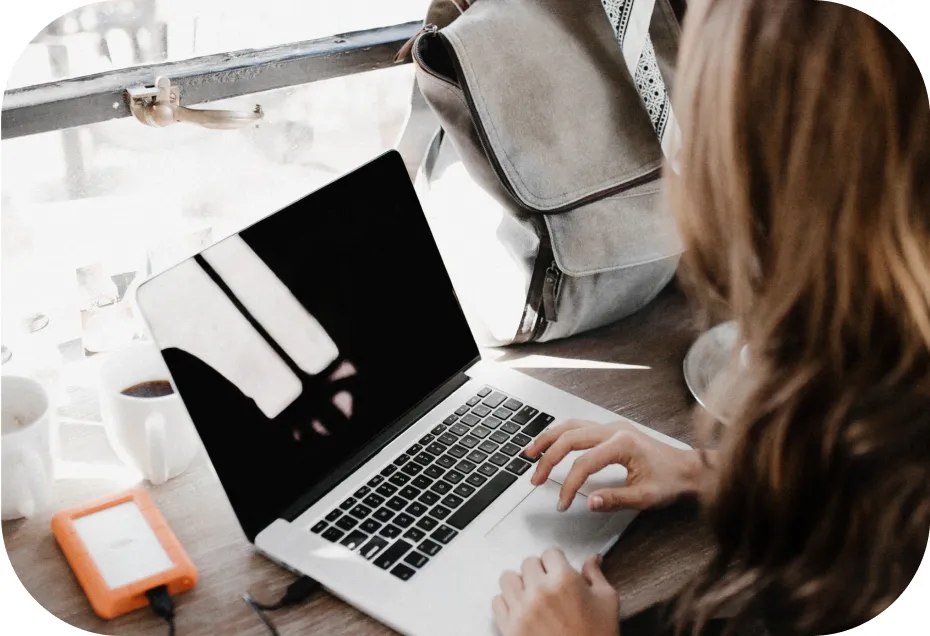 A woman doing something on her laptop