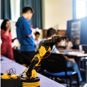 a yellow robot on a table