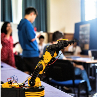a yellow robot on a table