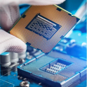 a person wearing gloves holding a mircochip