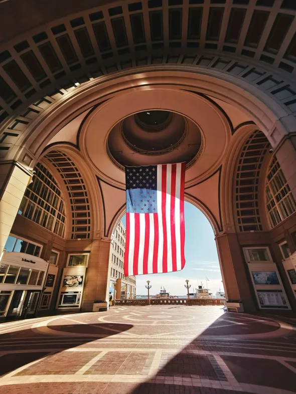 The elegant Boston Harbor Hotel, a waterfront property with a distinctive arched facade and luxurious design.