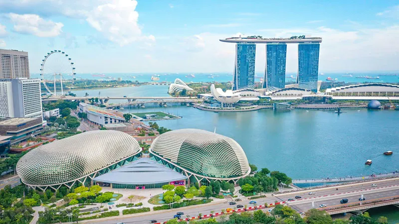 A larger image of a postcard from Singapore, showcasing detailed and colorful views of the city.