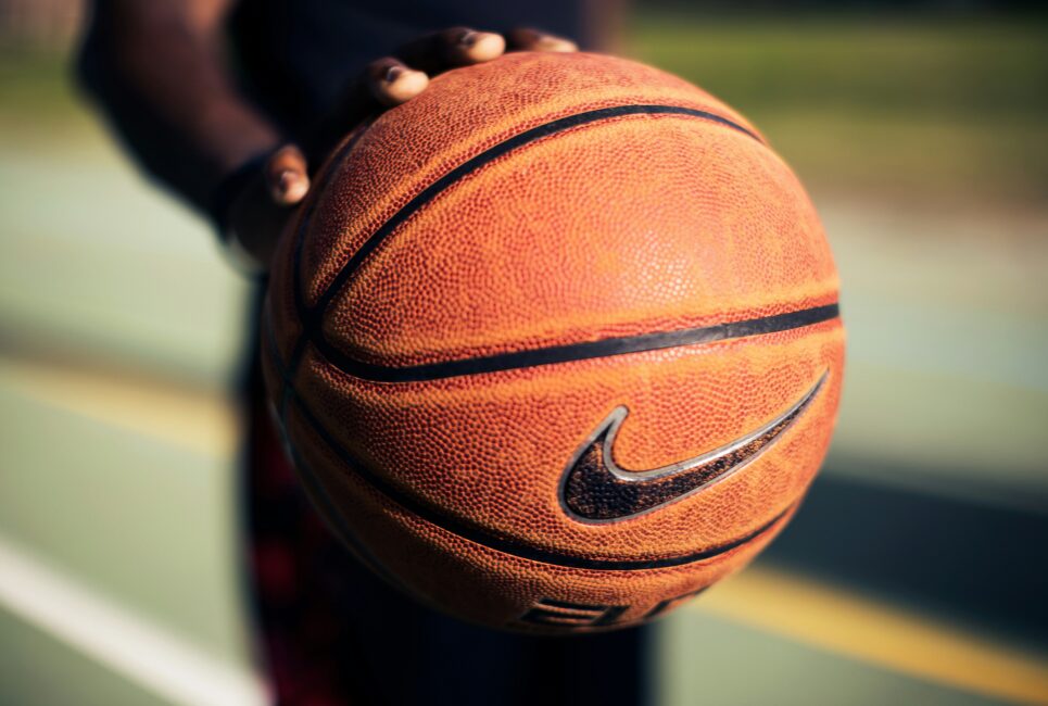 Hand on a basketball