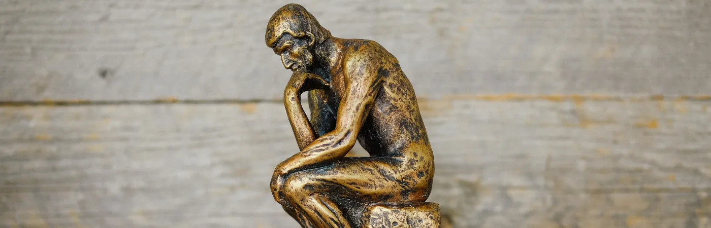 Gold thinking statue