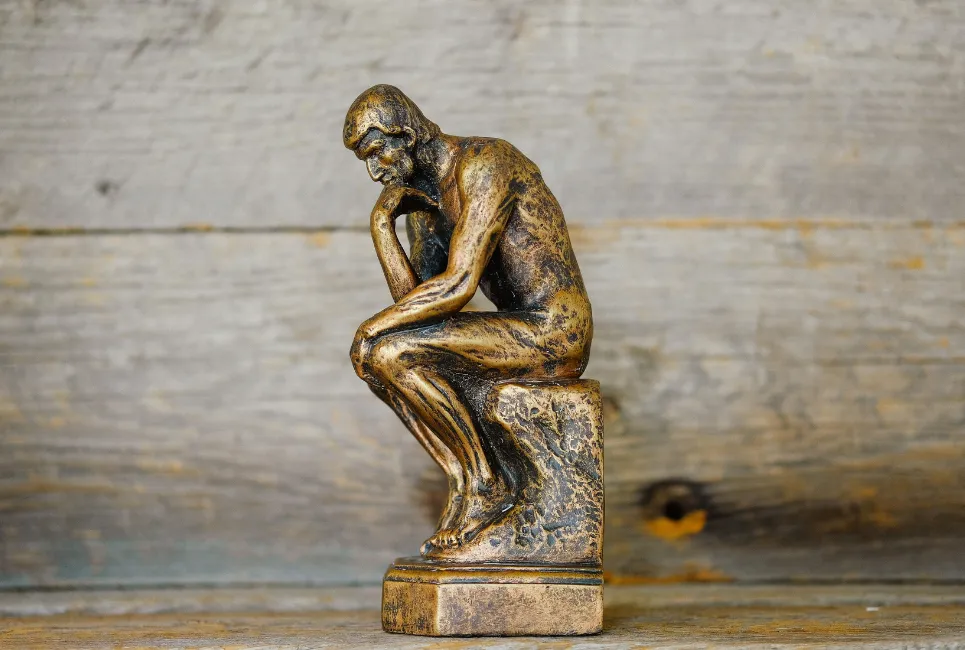 Gold thinking statue
