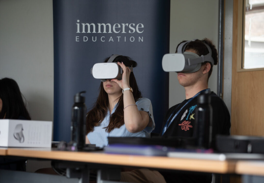 Students using VR in a lesson on coding