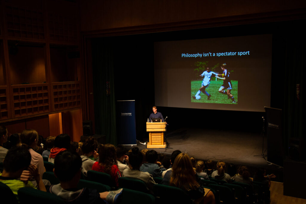 Tutor delivering a philosophy lecture